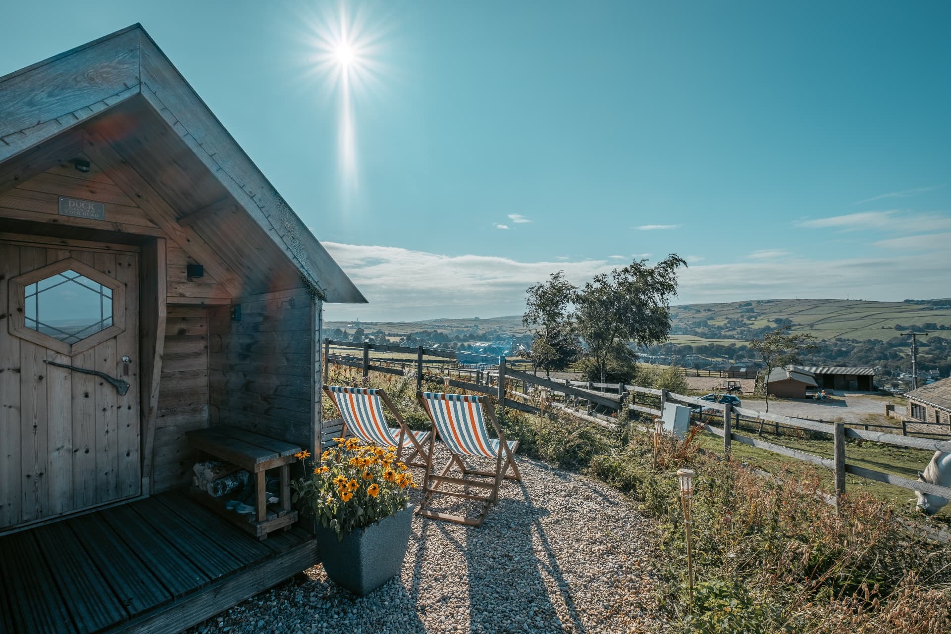 Striped deckchairs outside The Mallard overlooking the Yorkshire countryside